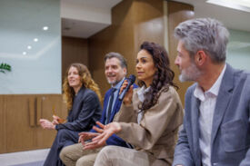 Audience member asking a question at an IEEE conference.